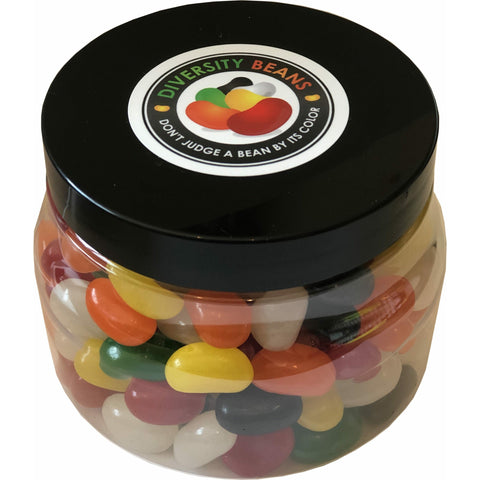 An image of a clear plastic jar with a black lid containing one pound of Diversity Beans. The jelly beans inside the jar exhibit a vibrant array of colors, including red, orange, yellow, green, black and white, each color has three different flavor options. The label on the jar reads &